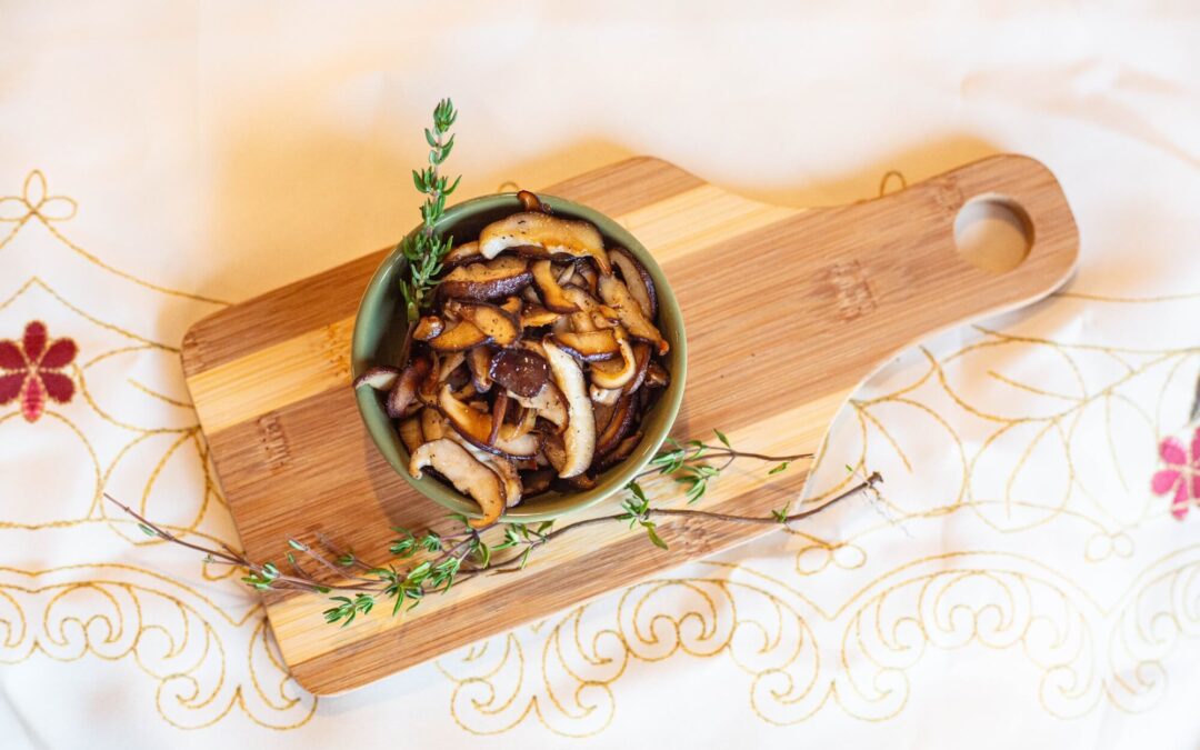 Image of Sauteed Shiitake in a bowl on a cutting board
